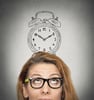 closeup headshot young business woman with alarm clock drawing sketch above her head, isolated grey wall background. Human face expressions, emotions. Time, punctuality, busy schedule concept closeup headshot young business woman with alarm clock drawing sketch above her head, isolated grey wall background. Human face expressions, emotions. Time, punctuality, busy schedule concept
